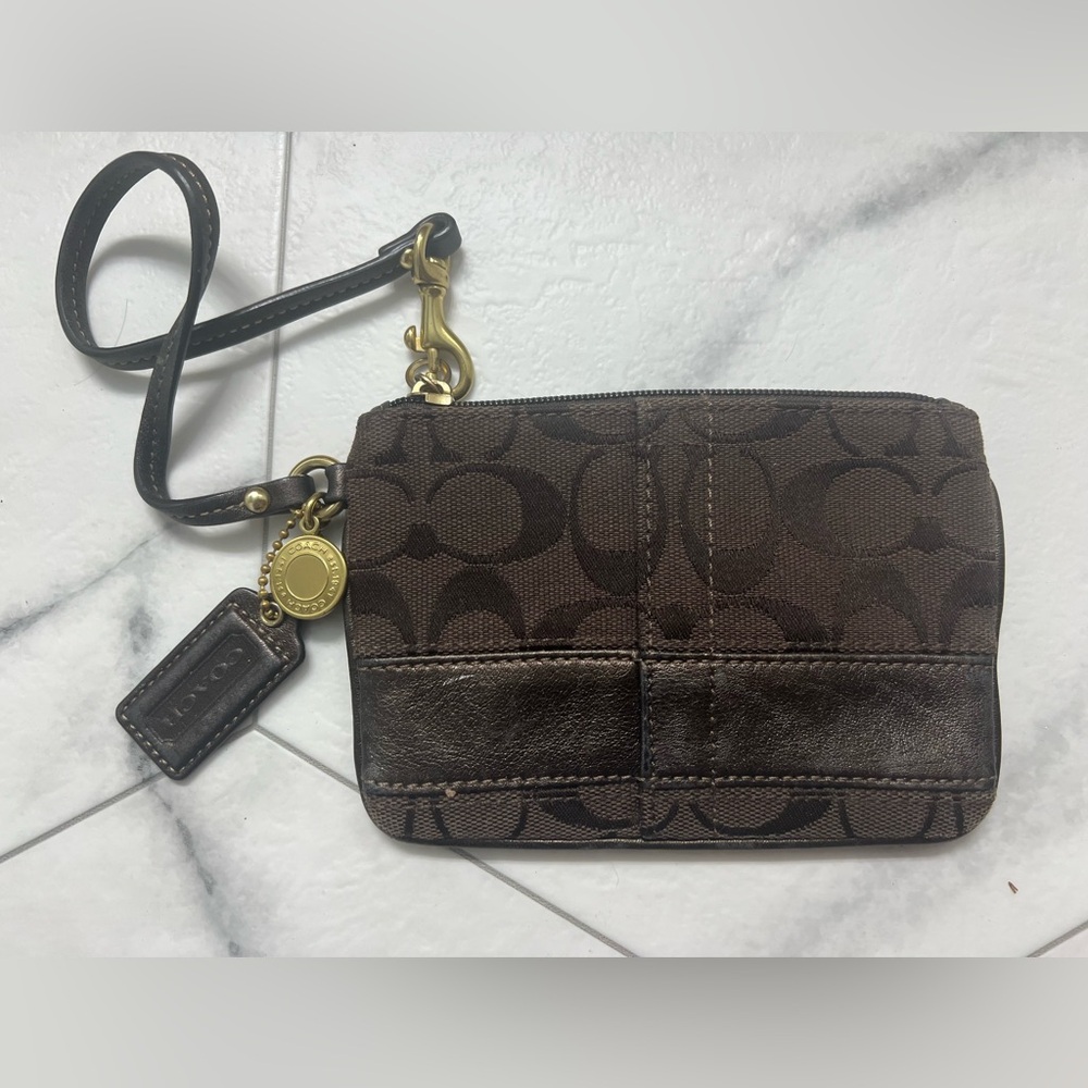 Coach Signature Stripe wristlet in chocolate brown